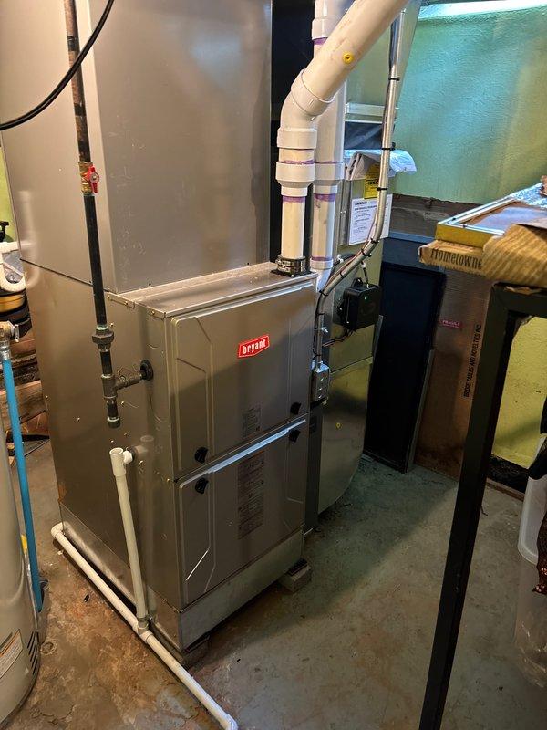 Completed installation of 4-ton air conditioning system with matching evaporator coil utilizing R-454B refrigerant. Unit installed at rear location with electrical reconnection performed. System installed in attic space with proper insulation and ductwork connections, while Bryant furnace and air handler remain in basement mechanical room. Mechanical and electrical permits requested and all manufacturer specifications followed for refrigerant compatibility and coil maintenance requirements.