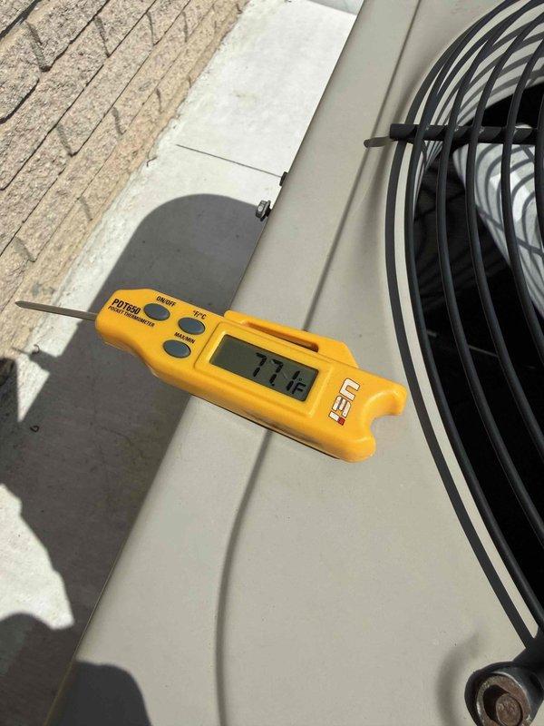 Completed comprehensive Gold AC inspection on 10+ year old residential air conditioning system with air handler located in basement. Performed electrical diagnostics using digital multimeter to verify proper voltage and amperage readings at control board and connections. Measured system temperatures, recording 77.1°F at outdoor condenser unit. Inspected all electrical components, wiring connections, circuit board functionality, and outdoor unit operation. System found to be operating within normal parameters with no immediate concerns identified. All safety checks completed and unit confirmed functional at time of inspection.