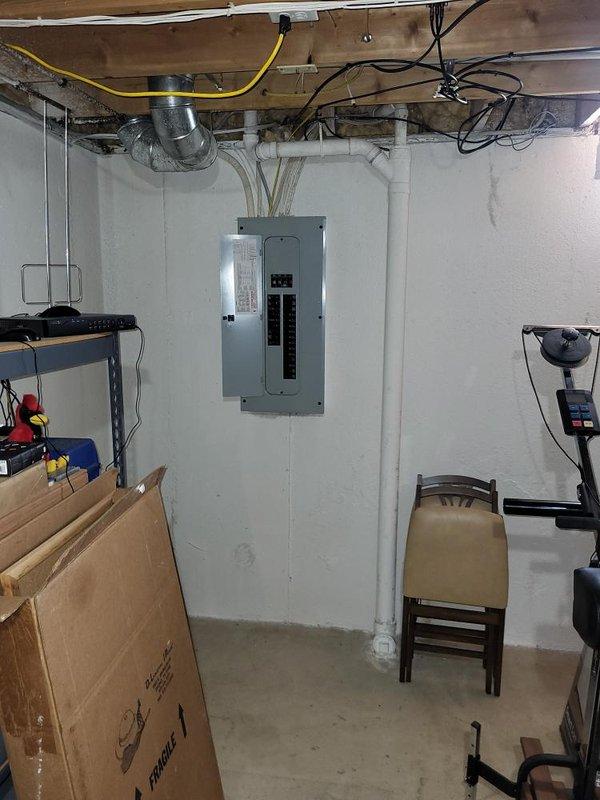Conducted on-site assessment for new whole home generator installation at manufactured home residence. Evaluated existing electrical infrastructure in basement utility area, documenting current electrical panel configuration and available conduit pathways for future generator integration. Provided detailed estimate for complete generator system installation including necessary electrical connections, transfer switch equipment, and required upgrades to support automatic backup power capabilities.