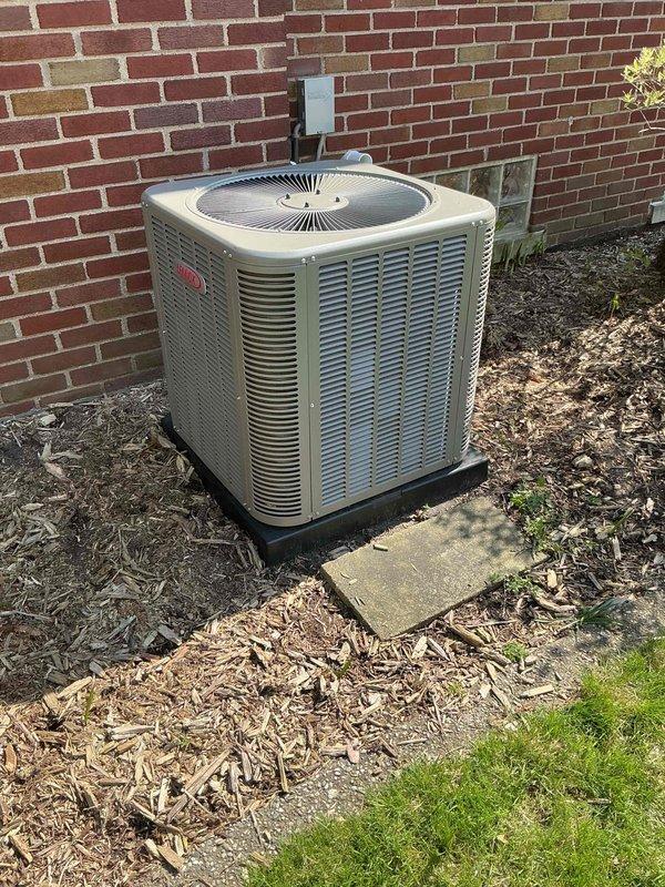 Completed comprehensive Gold AC inspection on Lennox ML14XC1-030-230A02 condensing unit with R-410A refrigerant. Equipment is less than one year old and operating normally at time of service. Performed visual inspection of outdoor condenser unit, verified proper installation on pad with adequate clearance from structure, inspected electrical connections and refrigerant line sets, and documented unit specifications including 208-230V electrical requirements and 6.9 lb refrigerant charge. Air handler located in basement. System confirmed operational with no deficiencies noted.