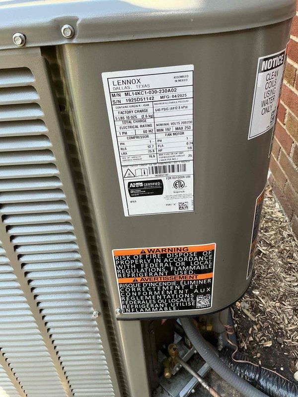 Completed comprehensive Gold AC inspection on Lennox ML14XC1-030-230A02 condensing unit with R-410A refrigerant. Equipment is less than one year old and operating normally at time of service. Performed visual inspection of outdoor condenser unit, verified proper installation on pad with adequate clearance from structure, inspected electrical connections and refrigerant line sets, and documented unit specifications including 208-230V electrical requirements and 6.9 lb refrigerant charge. Air handler located in basement. System confirmed operational with no deficiencies noted.