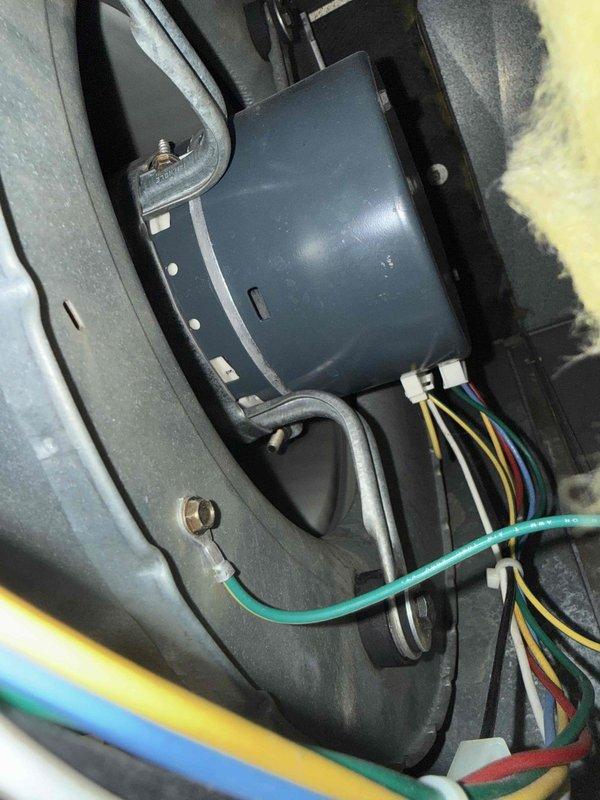 Completed comprehensive Gold AC inspection on 2007 air conditioning system with air handler located in basement. Performed full system evaluation including visual inspection of exterior condenser unit and interior electrical components. Inspected condenser base, refrigerant line connections, and surrounding foundation area. Examined internal electrical connections, control module housing, capacitor wiring, and safety grounding systems. Verified proper wire connections across multiple circuits including power and control wiring. Documented equipment condition through photographic records showing exterior condenser installation and internal electrical compartment components. System confirmed operational at time of inspection.