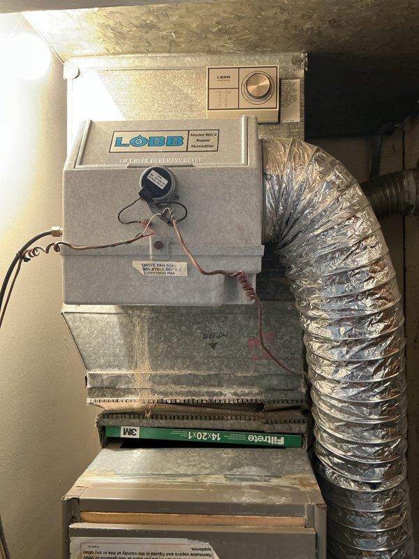 Completed HVAC system replacement for residential property involving removal of existing equipment and installation of new furnace and air conditioning system. Installed LOBB brand upflow/horizontal furnace unit in utility space with proper venting connections through flexible metallic ductwork and galvanized elbow transitions. Configured system with appropriate filtration using 14x20x1 Filtrete air filter, established electrical connections and control wiring, and mounted thermostat control panel for system operation. Verified all ductwork connections, tested system functionality, and ensured proper airflow throughout installation.