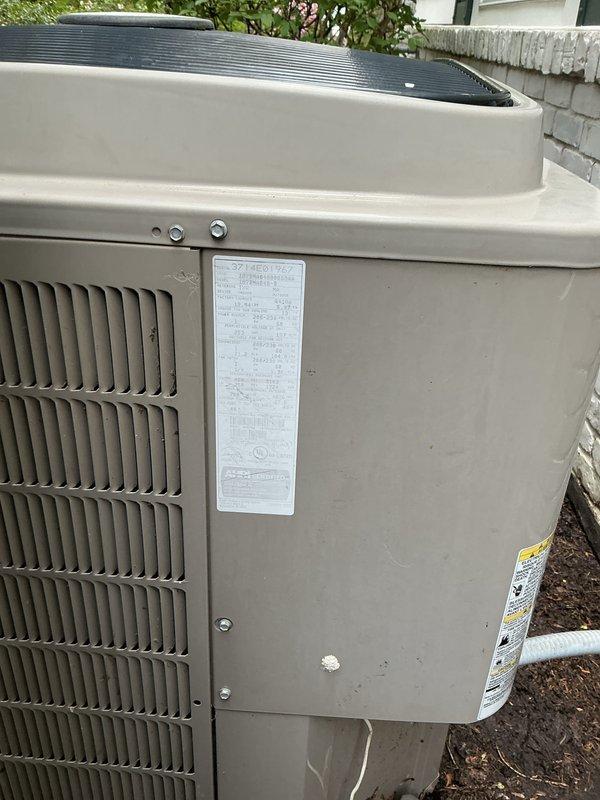 Completed comprehensive Gold AC Inspection on residential property with two HVAC units, both 8-10 years old with air handler located in basement. Both systems were operational at time of inspection. Outdoor condenser units were examined, photographed, and assessed for overall condition, showing normal weathering and environmental exposure consistent with age. Capacitor identified as requiring replacement and will be installed the following morning under purchase order for system optimization. All safety labels intact and protective grilles functioning properly on both units.