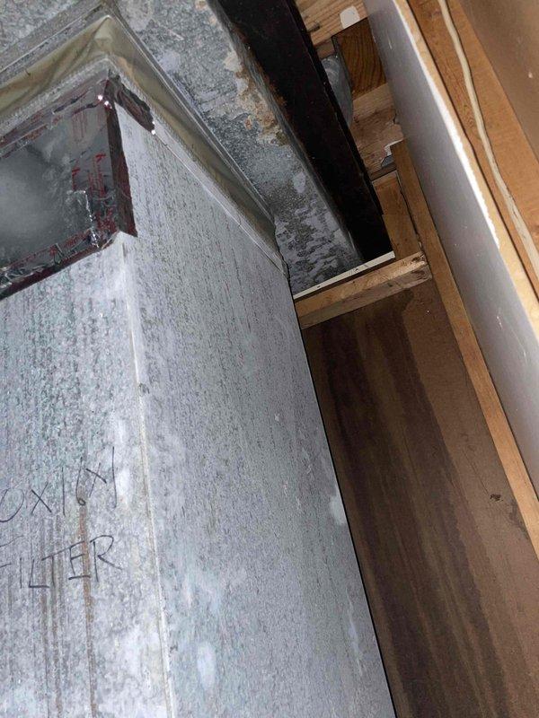 Conducted full system estimate for residential HVAC replacement. Documented extensive frost and ice buildup on main trunk ductwork in basement area, indicating significant insulation failure and potential air leakage issues. Observed moisture staining on concrete floor beneath affected ductwork and deterioration of surrounding wall materials. Inspected air handler unit showing considerable weathering, moisture staining, and surface corrosion. Photographed all equipment and problem areas for estimate documentation. Recommended complete system replacement due to age, condition, and ongoing moisture-related damage to ductwork and surrounding structure.