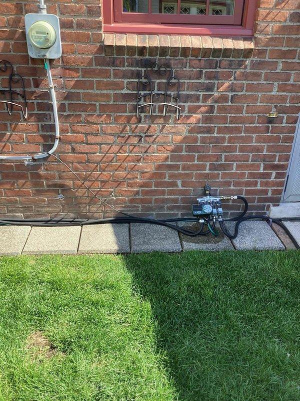 Provided estimate for complete HVAC system replacement including new furnace and air conditioning unit to replace 40-year-old equipment located in basement. Existing furnace currently operational but due for replacement due to age; air conditioning system will be new installation with outdoor condenser unit mounted on exterior brick wall where mounting brackets are visible.