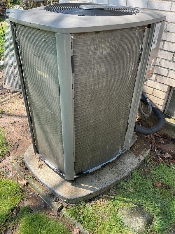 Completed annual Gold AC Tune-Up on 1-year-old Lennox air conditioning system. Performed comprehensive cooling maintenance inspection including condenser unit evaluation, refrigerant line assessment, and operational testing. System confirmed operating properly with all components functioning within normal parameters. Unit shows typical outdoor weathering with dirt accumulation on exterior panels and coil fins, but all mechanical and electrical components maintain structural integrity. Documented equipment condition with photos for service records.