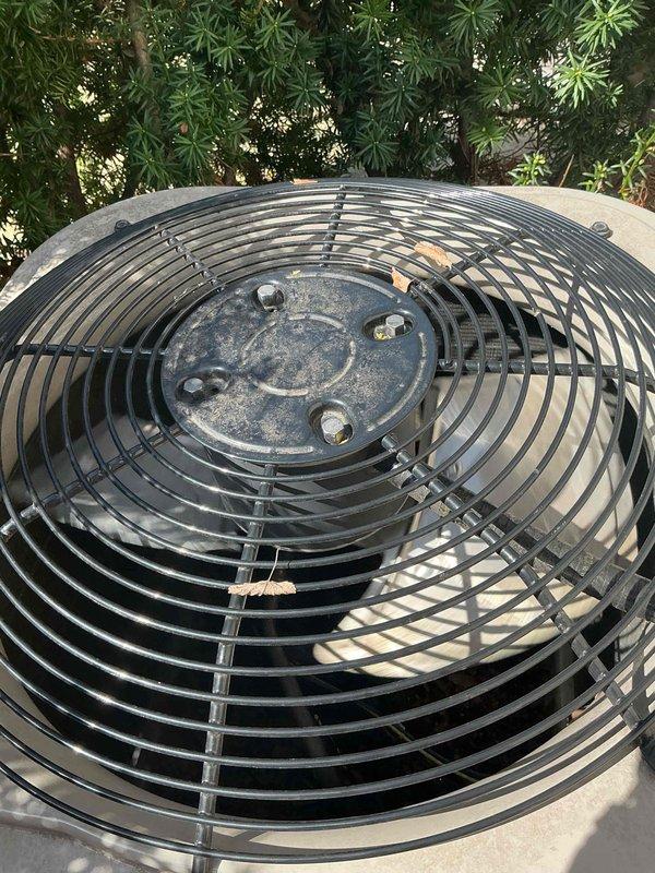 Completed Gold AC Inspection on multi-unit system with two zones servicing basement and upstairs locations. Equipment is approximately 6 years old and operational at time of inspection. Performed comprehensive maintenance evaluation of outdoor condenser unit and indoor air handlers per gold service protocol. Inspected outdoor unit fan assembly, verified proper operation, and noted environmental debris accumulation on fan guard requiring attention. Evaluated basement ductwork installation, mounting integrity, and associated plumbing connections. Documented system condition through photographic evidence showing outdoor condenser positioned in landscaped area and basement mechanical infrastructure with horizontal duct runs and support brackets. All inspection points completed in accordance with manufacturer specifications and industry standards for preventative maintenance service.
