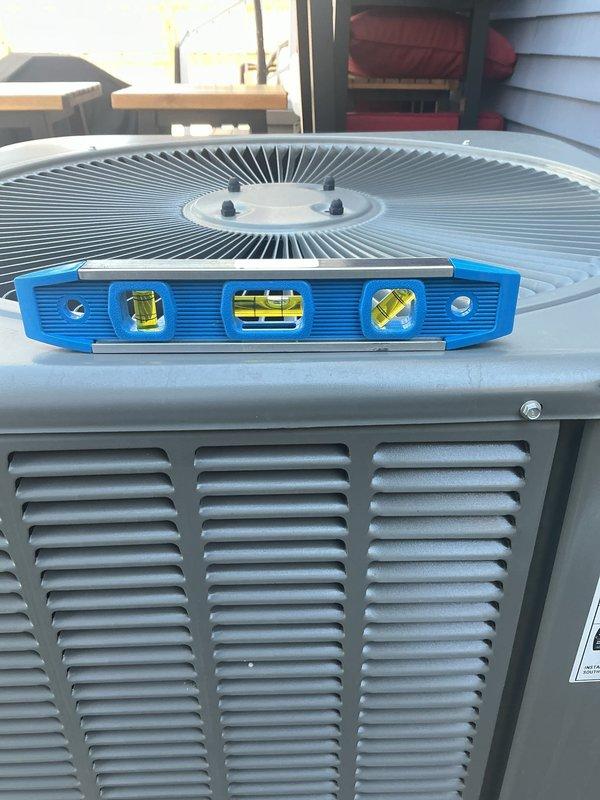 Responded to service call for unlevel condenser unit installed in 2024. Upon arrival, confirmed condenser was not properly leveled in backyard location. Repositioned and leveled condenser unit using precision leveling tools to ensure proper drainage and optimal compressor operation. Added 90-degree elbow fittings to refrigerant linesets to accommodate proper positioning and prevent stress on copper tubing connections. Verified unit stability and confirmed all refrigerant lines maintained proper pitch and support. System restored to manufacturer specifications for level installation.