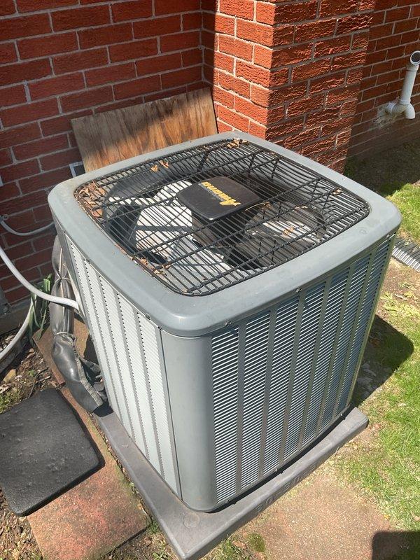 Completed comprehensive Gold AC inspection on an 8-year-old central air conditioning system with air handler located in basement. Performed thorough evaluation of indoor CAPF1560D1R unit, examining refrigerant lines, electrical connections, and all accessible components. Inspected outdoor condenser unit positioned on concrete pad against brick exterior, verifying proper operation of fan assembly, coil condition, and refrigerant line connections. System confirmed operational with no immediate deficiencies noted during inspection.