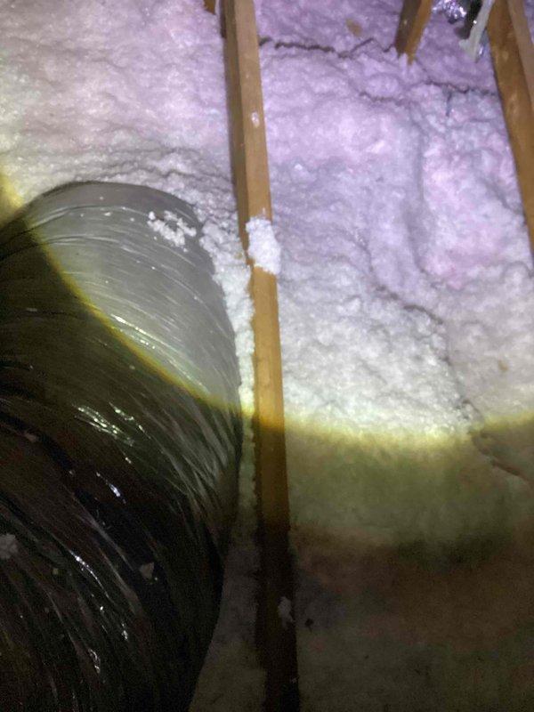 Conducted comprehensive estimate for complete HVAC system replacement in attic location. Evaluated 30-year-old Unico system utilizing R22 refrigerant with failed compressor exhibiting excessive amperage draw. Identified critical safety hazard with compressor wiring showing thermal damage, burning, and insulation bubbling. System was immediately shut down to prevent fire risk and further equipment damage. Documented existing flexible ductwork installation, including 18-inch diameter ducts with age-related deterioration, and assessed attic-mounted air handler/coil configuration. Performed gold-level AC inspection protocol for attic-installed equipment. Photographed existing ductwork conditions, insulation coverage, and HVAC infrastructure to support replacement specifications and scope of work.