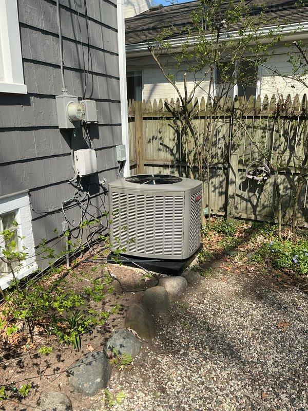 Completed full HVAC system replacement including installation of 70,000 BTU furnace and 2.5 ton rear-discharge air conditioning unit in basement mechanical room. Relocated furnace 3 inches to right to accommodate 1-inch filter access, connected all ductwork to existing distribution system, and installed S40 thermostat for system control. Performed refrigerant line flush, installed condensate pump for proper drainage, and reconnected existing humidifier to new furnace. Positioned outdoor condenser unit on gravel pad with proper clearances, installed electrical disconnect, and completed all electrical connections per code requirements. Secured mechanical and electrical permits prior to installation. Remeasured system specifications and registered AHRI certificate number 215663885 for utility rebate qualification. Tested all system operations including heating, cooling, humidification, and thermostat functionality to verify proper performance and customer satisfaction.