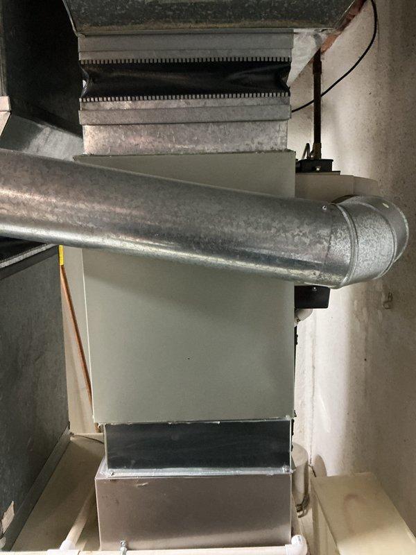 Conducted on-site assessment for air conditioning system replacement. Existing 10+ year old AC unit was non-operational and found to be empty of R410A refrigerant. Evaluated basement-mounted evaporator coil installation connected to existing natural gas furnace system. Inspected ductwork configuration, plenum connections, and electrical service panel with dual power supply for solar integration. Documented equipment specifications and provided replacement estimate for complete AC system compatible with current infrastructure.