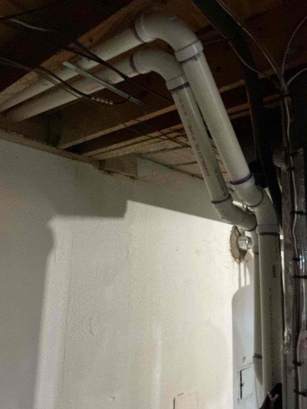 Completed installation of 70,000 BTU furnace with 180-degree rotation configuration, 600 CFM airflow capacity, and 4x25 venting system. Installed humidifier and liner as part of the mechanical system upgrade, with all work performed under mechanical permit. Applied for utility rebate upon completion, and documented installation with photographs showing proper venting configuration and PVC drainage routing through basement ceiling joists.