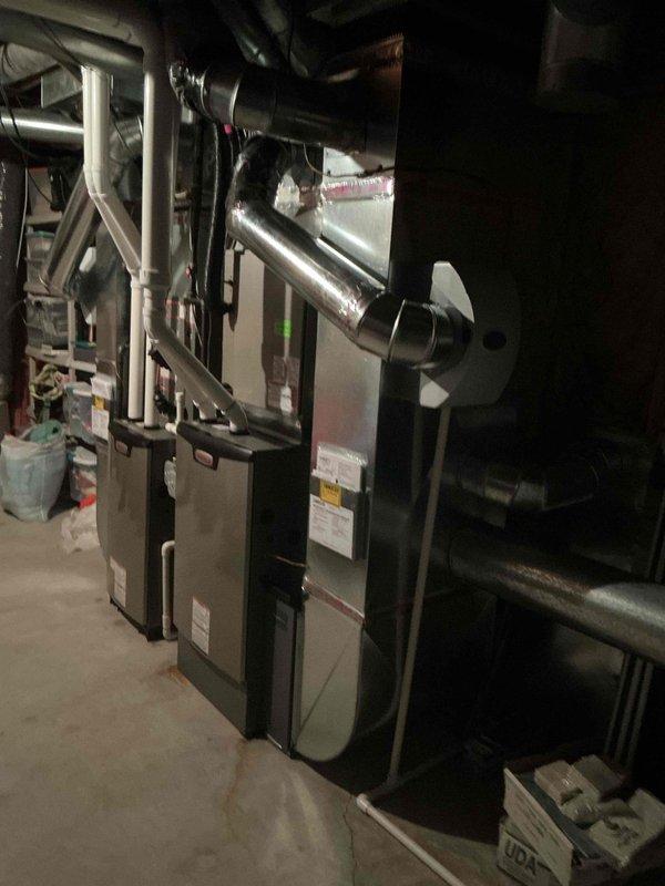 Completed installation of high-velocity furnace package system including base unit, S40 model, and 600M CFM capacity in basement mechanical room. Installed dual furnace configuration with metallic supply ductwork, PVC exhaust and intake venting through exterior brick wall, and all necessary piping connections. Permit requested and system qualified for applicable utility rebate programs upon completion.
