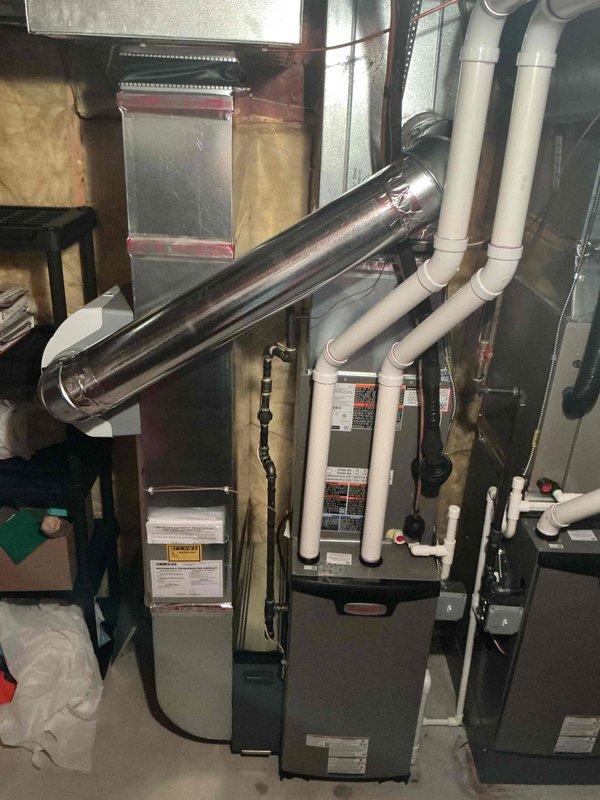 Completed full HVAC system installation including 110,000 BTU primary furnace and 70,000 BTU secondary furnace with 2.5 ton air conditioning unit configured for rear discharge. Installed complete PVC venting system, metallic ductwork with proper transitions, and reconnected two humidifiers to both furnace units. All mechanical permits obtained and systems tested for proper operation with utility rebate documentation submitted for both Consumers Energy and DTE programs.