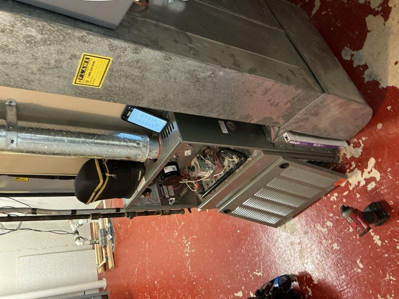 Completed comprehensive Gold AC Inspection on 10+ year old HVAC system located in basement. Unit was operational at time of service. Performed thorough examination of air handler components, including inspection of evaporator coil, copper refrigerant lines, electrical connections, and internal mechanical components. Assessed condition of heat exchanger fins, verified proper wiring connections, and examined ductwork connections including flexible duct transitions. System showing age-related wear consistent with equipment over 10 years old, but currently functioning as designed. All safety components and electrical connections verified during inspection.