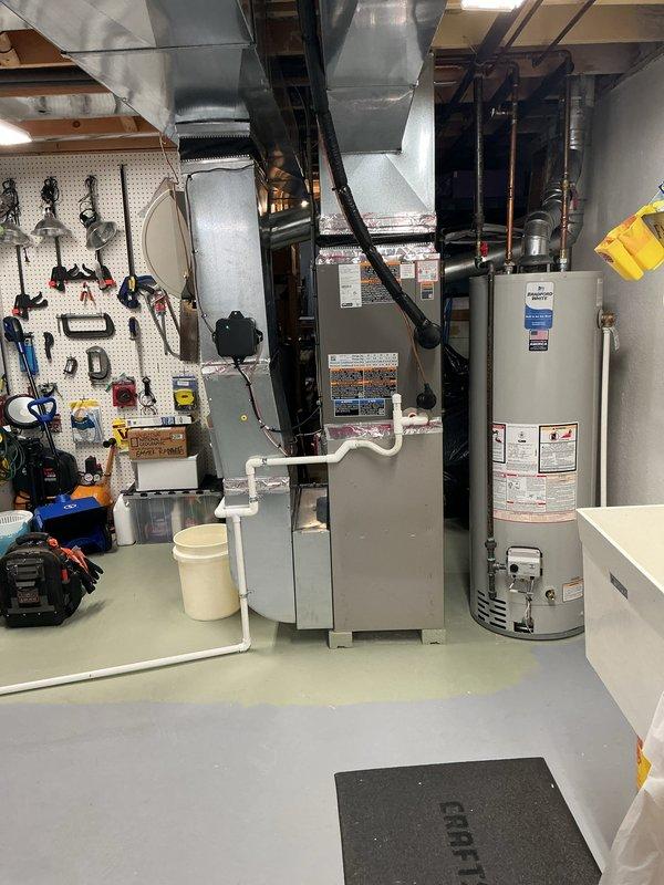 Completed comprehensive Gold AC inspection on 11-month-old residential HVAC system with air handler located in basement. Performed multi-point inspection including thermostat operation verification, condenser unit examination, air handler assessment, ductwork inspection, and system performance evaluation. All equipment found operating within normal parameters with no immediate service concerns identified. System confirmed cooling properly with appropriate temperature differential across coil and satisfactory airflow throughout distribution system.