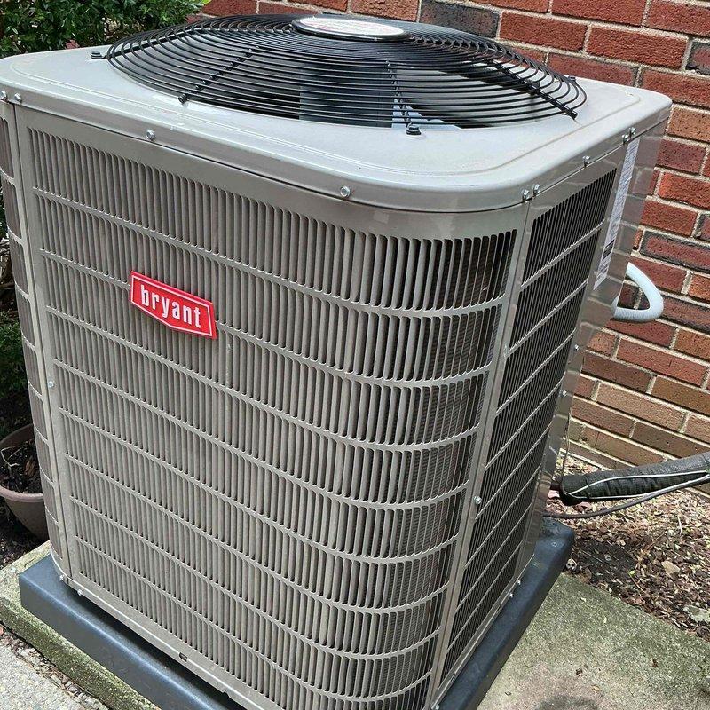 Completed comprehensive Gold AC inspection on 6-year-old Bryant air conditioning system. Thoroughly examined outdoor condenser unit, confirming fins are clean, straight, and free of damage, with proper airflow through coils. Verified equipment is operating correctly with air handler located in basement. Unit is properly positioned on concrete pad with adequate clearance, and surrounding area is clear of debris. All components inspected and found to be in good working condition with no immediate service needs identified.
