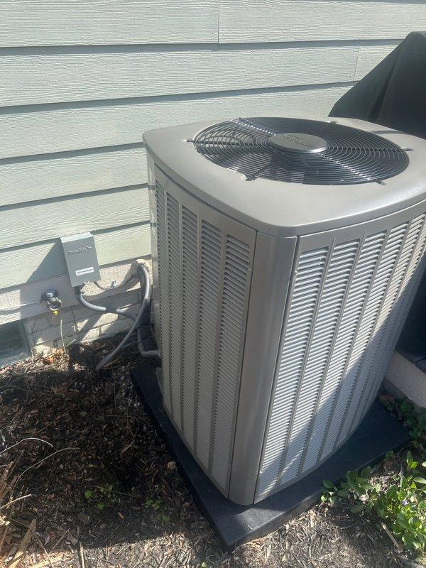 Completed air conditioning system startup on newly installed Lennox equipment. Performed initial system commissioning on outdoor condenser unit with proper electrical disconnect installation and verified all connections secure. Programmed and configured Lennox digital thermostat to operational parameters, confirmed system communication and control functionality at 70°F setpoint with proper stage operation indicated.