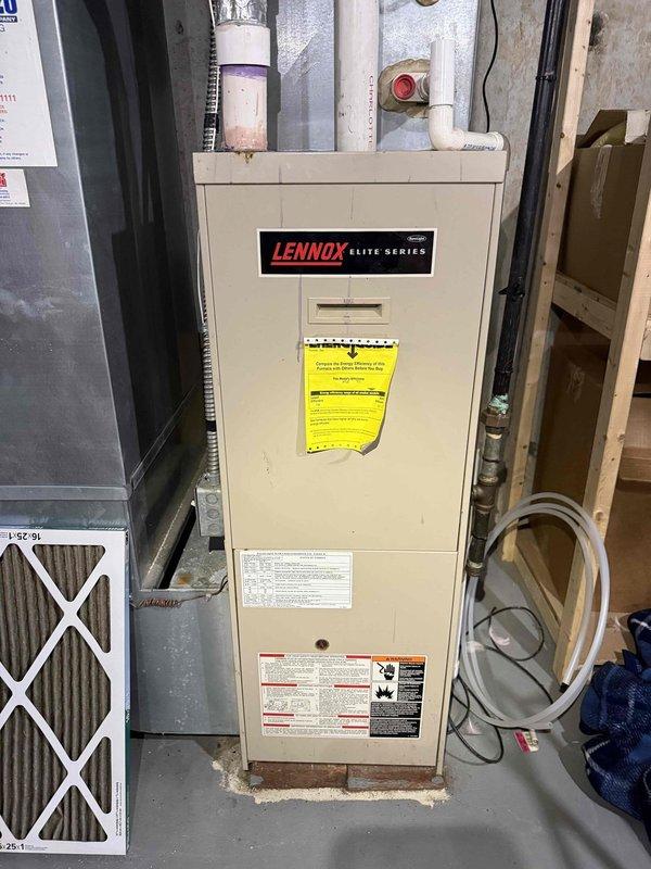 Performed comprehensive tune-up and inspection on 25-year-old Lennox Elite Series furnace and air conditioning system. Conducted thorough examination of furnace cabinet, heat exchanger, burner assembly, and venting system including PVC intake and exhaust piping. Inspected pressure switch operation, condensate drain lines, and all safety controls. Verified proper airflow and replaced standard pleated air filter. Performed internal camera inspection of heat exchanger to assess for cracks or deterioration, documenting findings with endoscopic imaging. Evaluated thermostat operation and calibration. Inspected humidifier system for proper function and water supply. Checked hot water tank connections and venting. Examined outdoor condensing unit components including compressor, condenser coil, refrigerant lines, and electrical connections. All systems tested and operational at time of inspection.