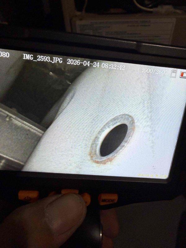 Performed comprehensive tune-up and inspection on 25-year-old Lennox Elite Series furnace and air conditioning system. Conducted thorough examination of furnace cabinet, heat exchanger, burner assembly, and venting system including PVC intake and exhaust piping. Inspected pressure switch operation, condensate drain lines, and all safety controls. Verified proper airflow and replaced standard pleated air filter. Performed internal camera inspection of heat exchanger to assess for cracks or deterioration, documenting findings with endoscopic imaging. Evaluated thermostat operation and calibration. Inspected humidifier system for proper function and water supply. Checked hot water tank connections and venting. Examined outdoor condensing unit components including compressor, condenser coil, refrigerant lines, and electrical connections. All systems tested and operational at time of inspection.