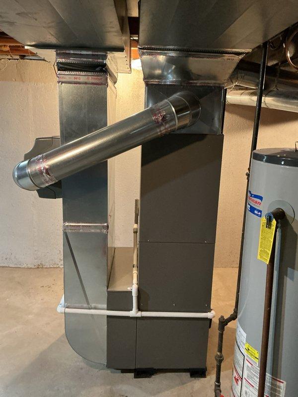 Performed AC inspection on 12-year-old outdoor unit as part of gold maintenance plan. System found to be low on refrigerant, indicating a potential leak in the system. Provided estimate for AC replacement given the age of the unit and refrigerant loss. Evaluated furnace filter and humidifier filter condition in basement mechanical room per customer request and advised on replacement needs.
