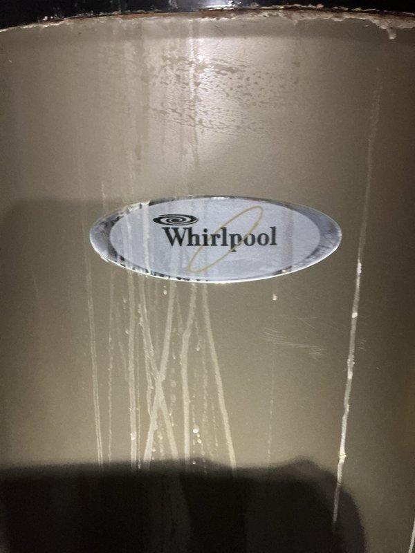 Completed comprehensive tune-up service on 17-year-old furnace and air conditioning system located in basement. Both units confirmed operational at time of inspection. Notable finding: significant rust and corrosion observed at base of equipment with white mineral deposits indicating historical moisture exposure or water damage around foundation area. Whirlpool branded water heater also present in mechanical room showing normal wear patterns. All systems currently functioning as designed, though age of equipment and corrosion patterns warrant monitoring for future service needs.