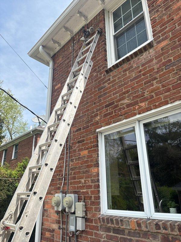 Responded to service call for non-functioning outdoor flood lights on two-story brick residence. Upon inspection, accessed exterior lighting circuit and identified failed switching mechanism controlling the flood light fixtures. Removed defective dual-gang switch assembly from interior wall cavity, verified wiring connections, and prepared for replacement of switching components to restore proper operation of exterior lighting system.
