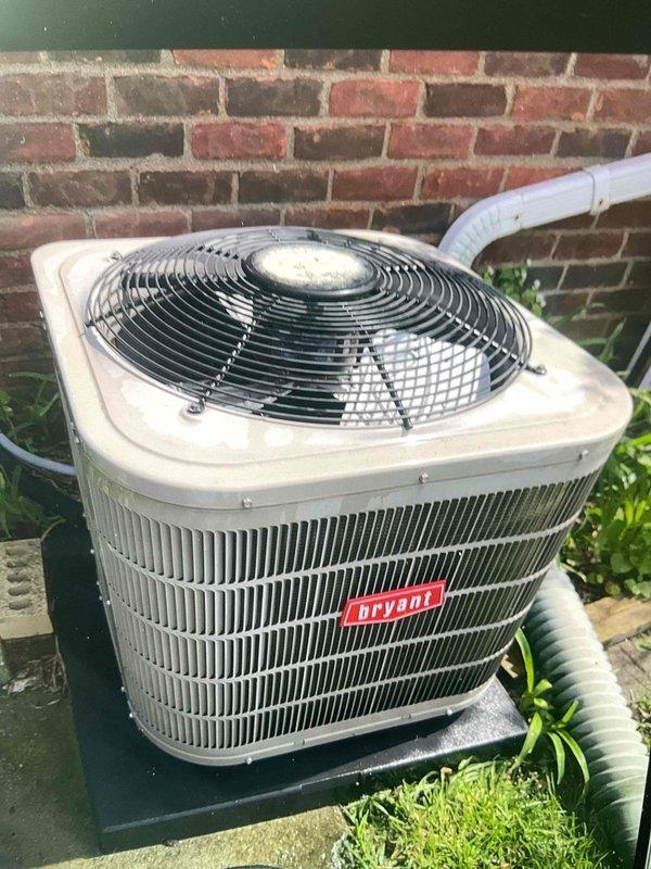 Completed comprehensive Gold AC inspection on 13-year-old Bryant air conditioning system with air handler located in basement. Performed thorough evaluation of outdoor condenser unit, including inspection of compressor, fan motor operation, and electrical components. Examined capacitor specifications (370/440VAC, 85+5 MFD) and verified proper electrical connections, noting age-related wear and minor surface oxidation on capacitor housing consistent with unit age. Confirmed condenser unit positioned properly on platform with adequate clearance, PVC condensate line routing appropriately, and surrounding area clear of debris. Assessed overall system operation and component condition, documenting equipment status through photographic records for maintenance history.