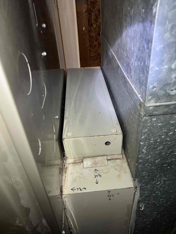 Completed Gold AC Inspection on 19-year-old single HVAC system with air handler located in basement. Performed comprehensive diagnostic testing including capacitor testing using digital multimeter, which measured 7.5μF capacitor at 370VAC specifications. Inspected ductwork, metal housing components, and system operation. Unit was operational at time of inspection with all components functioning within normal parameters. Documented system measurements and specifications on equipment housing for maintenance records.