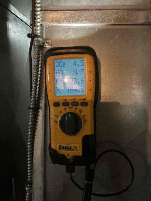 Completed comprehensive tune-up inspection on basement-located HVAC system of unknown age. Performed diagnostic testing of system performance parameters including CO2 levels, humidity readings, and temperature measurements using calibrated digital meter. Inspection included thorough evaluation of humidifier operation, thermostat functionality, air handler components, and hot water tank condition, with replacement of air filter as part of standard maintenance protocol.