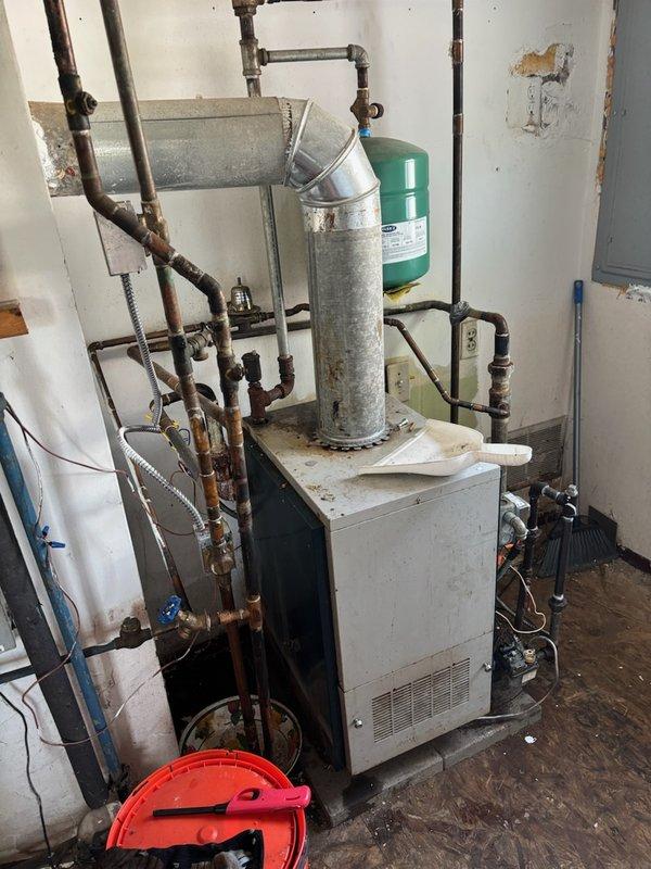 Responded to service call for 14+ year old boiler system experiencing daily water loss requiring manual filling. Upon diagnostic inspection, confirmed pressure reducing valve failure causing system to lose pressure. Replaced defective pressure reducing valve and associated components. Tested system operation, verified proper pressure maintenance, and confirmed expansion tank functionality. System now maintaining proper pressure without requiring daily manual water addition.