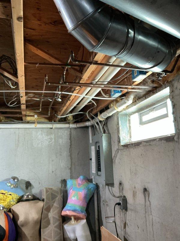 Completed comprehensive estimate for full HVAC system replacement on 25-year-old furnace and air conditioning units located in basement and exterior of property. Primary concern identified was cracked heat exchanger in existing furnace, which poses safety hazard and requires immediate replacement. Conducted thorough inspection of both heating and cooling systems, evaluated humidifier functionality, assessed thermostat operation, and inspected hot water tank as part of complete system evaluation. Documented existing installation conditions including ductwork configuration, electrical panel connections, and equipment placement in unfinished basement utility area. Provided detailed replacement quote for new furnace and air conditioner system to address failed heat exchanger and aging equipment that has exceeded expected service life.