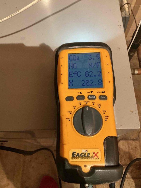 Responded to service call for leaking pressure relief valve on 20-year-old hot water boiler located in basement near sump pump. Performed diagnostic inspection of boiler system and pressure relief valve assembly, utilizing digital testing equipment to assess system pressure and operational parameters. Documented existing conditions of heating equipment, associated copper piping, and valve connections for homeowner records.
