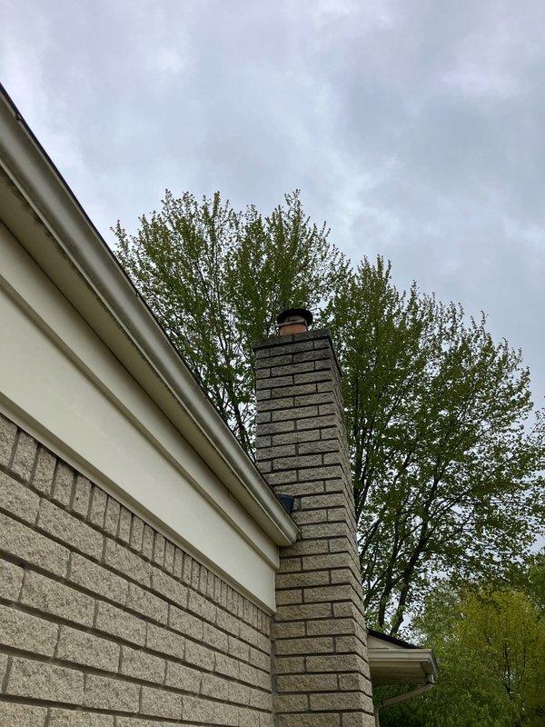 Provided estimate for replacement of 20-year-old residential air conditioning and furnace system. Existing outdoor AC unit located on concrete pad against exterior wall shows significant weathering and age-related deterioration. Natural gas furnace currently installed in basement requires replacement along with outdoor condensing unit to restore efficient cooling and heating operation.