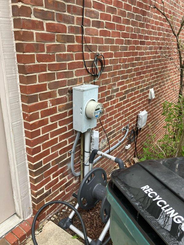 Conducted comprehensive site assessment for full HVAC system replacement and furnace installation. Documented existing electrical infrastructure including main service panel with digital monitoring system and exterior meter configuration to verify adequate electrical capacity for new equipment installation. Evaluated current breaker panel layout with approximately 30-40 circuit positions to determine compatibility requirements and potential electrical upgrades needed to support new heating system specifications.