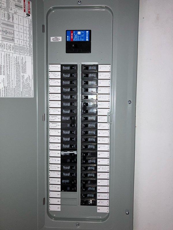 Conducted comprehensive site assessment for full HVAC system replacement and furnace installation. Documented existing electrical infrastructure including main service panel with digital monitoring system and exterior meter configuration to verify adequate electrical capacity for new equipment installation. Evaluated current breaker panel layout with approximately 30-40 circuit positions to determine compatibility requirements and potential electrical upgrades needed to support new heating system specifications.