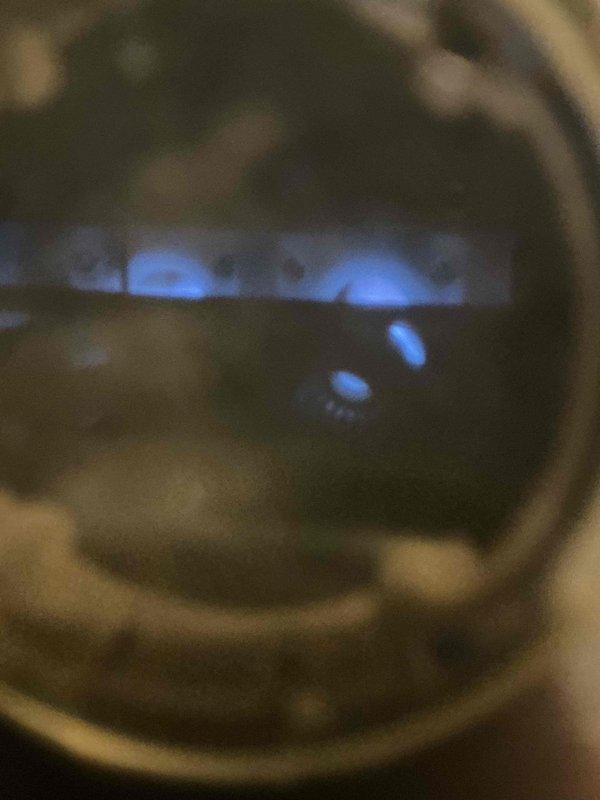 Responded to no heat call on 10+ year old furnace located in closet. Performed diagnostic evaluation and inspected unit components including rating plate and burner assembly. Identified system malfunction preventing heat operation and documented equipment specifications for service records.