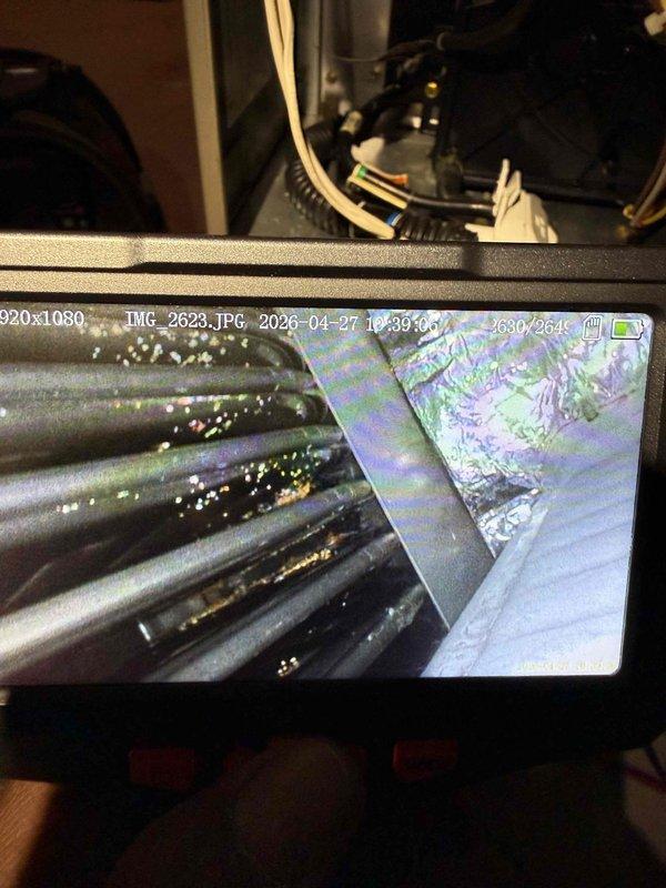Responded to no heat call on 18-year-old furnace in basement that was blowing air but not heating. Upon inspection, performed diagnostic assessment of heating system including visual inspection of heat exchanger, burner assembly, and internal components using inspection camera equipment. Heat exchanger showed visible deposits and potential deterioration consistent with age of unit. Documented findings with photographic evidence of internal components showing wear and accumulation. Discussed system condition with homeowner, noting that furnace has exceeded typical service life expectancy of 15-20 years and is showing signs of significant age-related deterioration that could affect safe operation and heating performance.