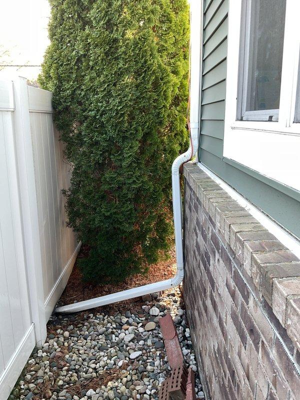 Completed installation of 3.5-ton air conditioning unit with new evaporator coil on left side of residence. System was positioned in narrow side yard area against privacy fencing on gravel base, with unit properly secured and leveled. Electrical reconnection was performed in accordance with code requirements. Mechanical and electrical permits were requested and processed for the installation. System was flushed, tested, and verified operational upon completion.