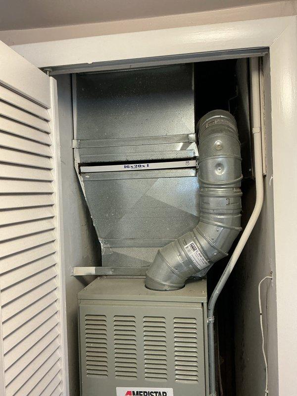 Responded to service call for central air conditioning system not cooling the home. Upon inspection, found R22 refrigerant system with Ameristar air handler in interior utility closet and outdoor condenser unit. System was running but failing to provide adequate cooling. Evaluated both indoor and outdoor components, checked refrigerant levels, and assessed overall system condition. Provided comprehensive estimate for complete HVAC system replacement due to obsolete R22 refrigerant and age-related equipment concerns. Documented existing installation with photos showing indoor air handler with ductwork configuration and outdoor condenser unit on concrete pad with refrigerant lines and electrical connections.