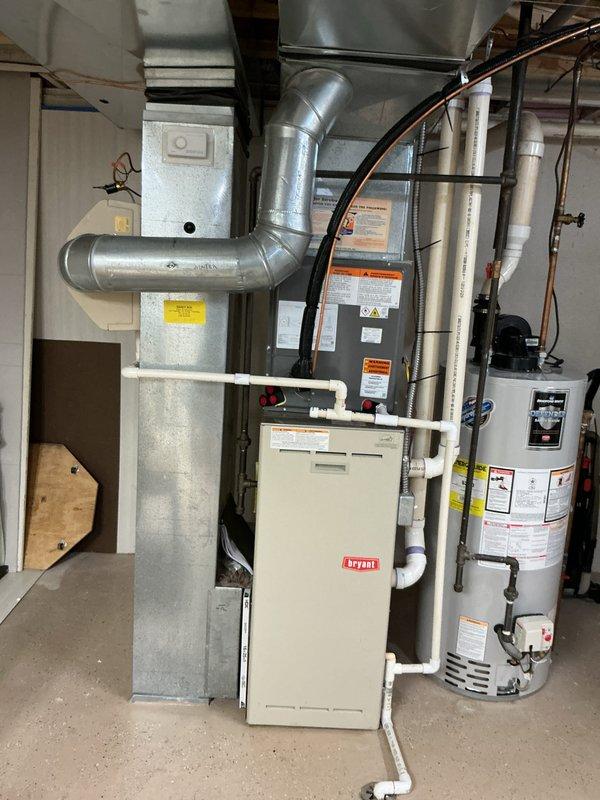 Responded to no-heat call on 23-year-old Bryant furnace located in basement. Upon inspection, confirmed unit was shut down for safety due to compromised heat exchanger exhibiting orange flaking and corrosion, previously identified after high limit and rollout switch replacements by another contractor. Documented existing HVAC system configuration including furnace, ductwork, and water heater setup. Provided comprehensive replacement estimate for furnace only, as existing air conditioning system is newer and operational.