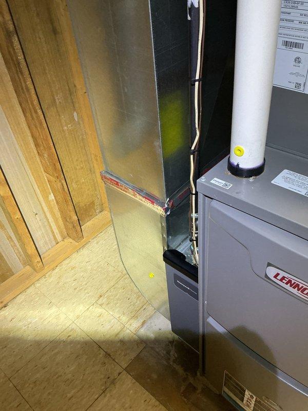 Responded to reported intermittent gas odor in residence with unclear source. Performed comprehensive gas leak inspection of basement mechanical room, including thorough examination of 5-year-old water heater and Lennox furnace system. Conducted combustible gas detection testing at all gas appliances, connections, and supply lines. Inspected furnace burner assembly, heat exchanger, and venting system for proper operation and integrity. Evaluated water heater flue pipe, gas valve, and burner compartment. Verified proper ventilation and combustion air supply in mechanical room. All gas connections tested negative for leaks, appliances operating within normal parameters. Documented equipment condition with photographs for record. No active gas leaks detected during service visit; both heating systems functioning properly with adequate venting.