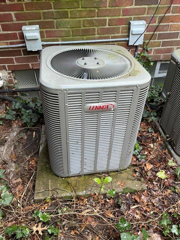 Completed comprehensive tune-up and performance evaluation on 10-year-old Lennox air conditioning system with basement coil. Performed system diagnostics measuring airside temperatures showing proper operation with 12.0°F delta T, return air at 68.2°F dry bulb with 50.7% relative humidity, and supply air at 56.2°F dry bulb with 67.0% relative humidity. Inspected outdoor condensing unit positioned on exterior concrete pad, noting vegetation growth around base and organic debris accumulation requiring routine maintenance attention for optimal airflow and efficiency.