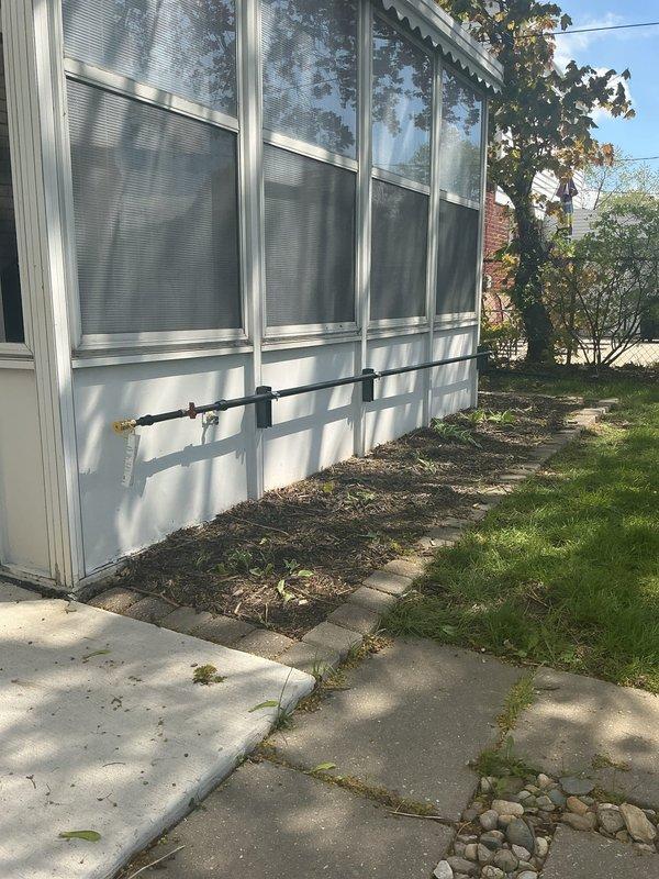 Installed new gas line from existing supply to outdoor grill location on residential property. Routed black iron pipe along exterior foundation, ensuring proper support and code-compliant installation. Pressure tested system and verified all connections for safe operation.