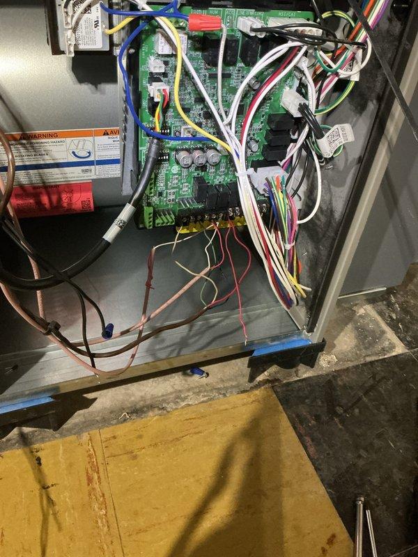 Responded to callback for recently installed furnace and AC system not powering on. Inspected control board and wiring connections on furnace unit, photographed internal components including green circuit board with multiple wire connections and terminals. Determined Focus Pro thermostat required replacement from original installation and is currently at shop for exchange. Provided customer with Honeywell Home FocusPRO P200 Series thermostat user guide and quick reference documentation. System includes 70,000 BTU furnace, 2.5 ton AC unit, humidifier, APCO air purification system, and related components from initial installation requiring follow-up service to complete thermostat replacement and restore full system operation.