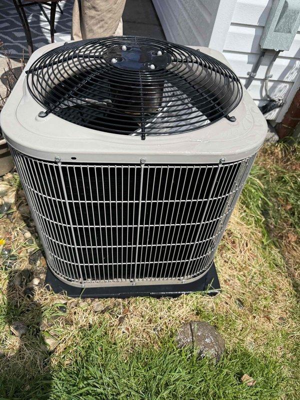 Completed comprehensive tune-up service on a 10-year-old residential air conditioning system with basement coil and outdoor condenser unit. Performed full system inspection including condenser coil cleaning, verified proper refrigerant levels, checked electrical connections, tested capacitor and contactor operation, and confirmed fan motor functionality. Unit operating within manufacturer specifications with no immediate service needs identified; condenser fins in good condition with minimal debris accumulation noted around exterior placement area.