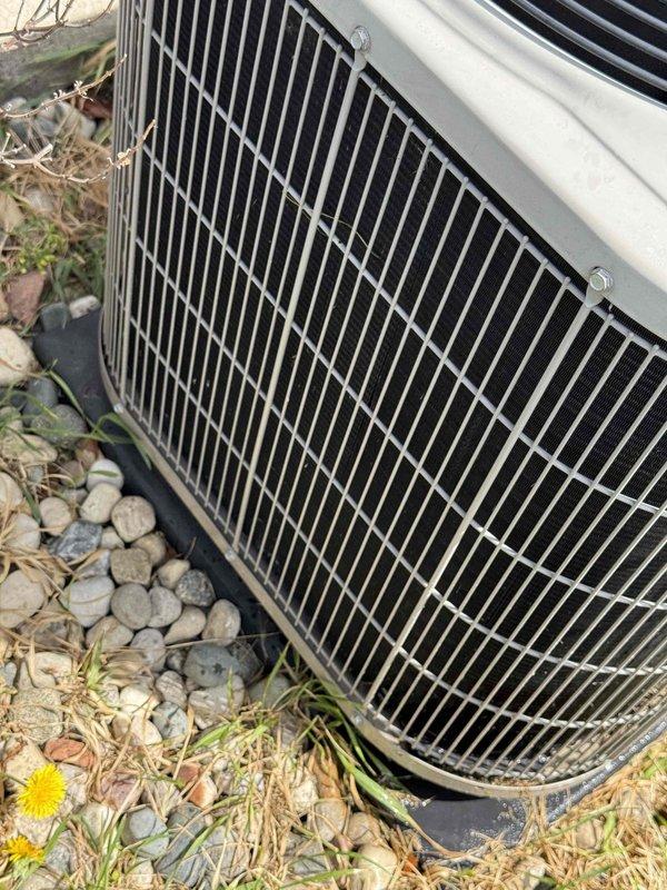 Completed comprehensive tune-up service on a 10-year-old residential air conditioning system with basement coil and outdoor condenser unit. Performed full system inspection including condenser coil cleaning, verified proper refrigerant levels, checked electrical connections, tested capacitor and contactor operation, and confirmed fan motor functionality. Unit operating within manufacturer specifications with no immediate service needs identified; condenser fins in good condition with minimal debris accumulation noted around exterior placement area.