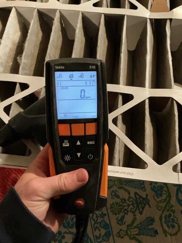 Completed comprehensive Gold Furnace Inspection on 9-year-old forced air system located in basement of multi-unit residential property. Performed combustion analysis using Testo 310 analyzer, which confirmed safe operation with 0 ppm carbon monoxide readings. Inspected and evaluated existing air filtration system, documenting filter condition with photographic evidence showing clean pleated MERV-rated filters in proper working condition. All equipment found to be operational at time of inspection with no immediate safety concerns or required repairs identified.